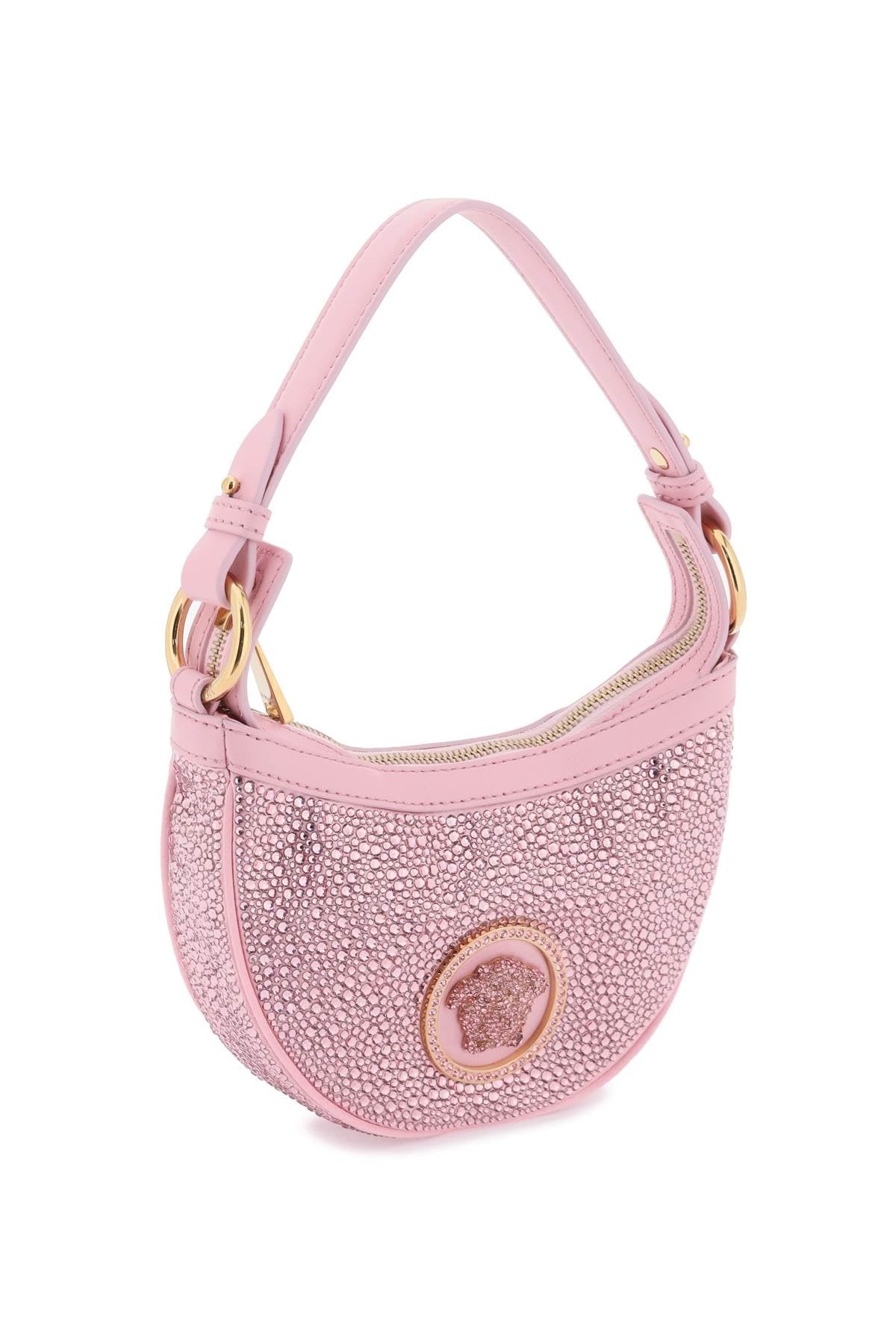 粉色小方型手提包，搭配水晶與時尚設計師的招牌Medusa標誌