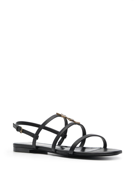 SAINT LAURENT EXPERIENCE ELEVATED DESIGN WITH THESE MUST-HAVE CASSANDRA MONOGRAM FLAT SANDALS