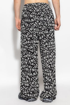 BALENCIAGA High-End Men's Fashion: All-Over Logo Printed Cotton Trousers for FW23