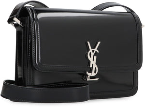 Black Leather Messenger Bag with Flip-Lock Closure and Adjustable Strap