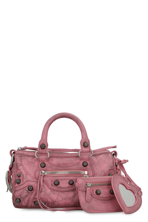 BALENCIAGA Mini Duffle Vintage Pink Lamb Leather Crossbody Bag with Decorative Studs and Removable Pouch
