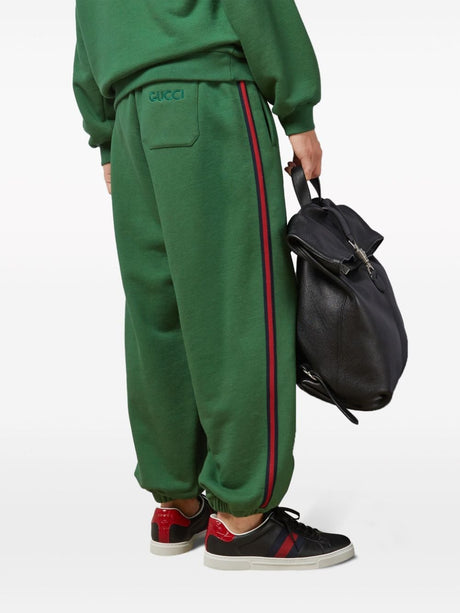 绿色高档棉质运动裤，经典标志绣花和网带装饰