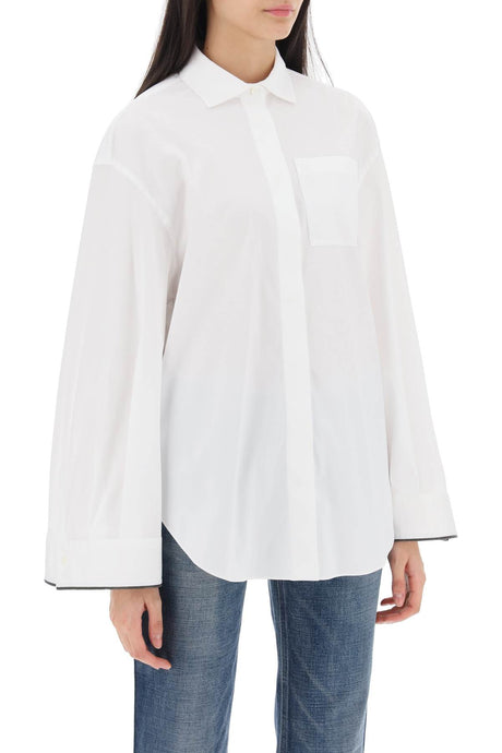 上品な白のワイドスリーブシャツ、光沢のあるカフスのディテールがポイント、女性用